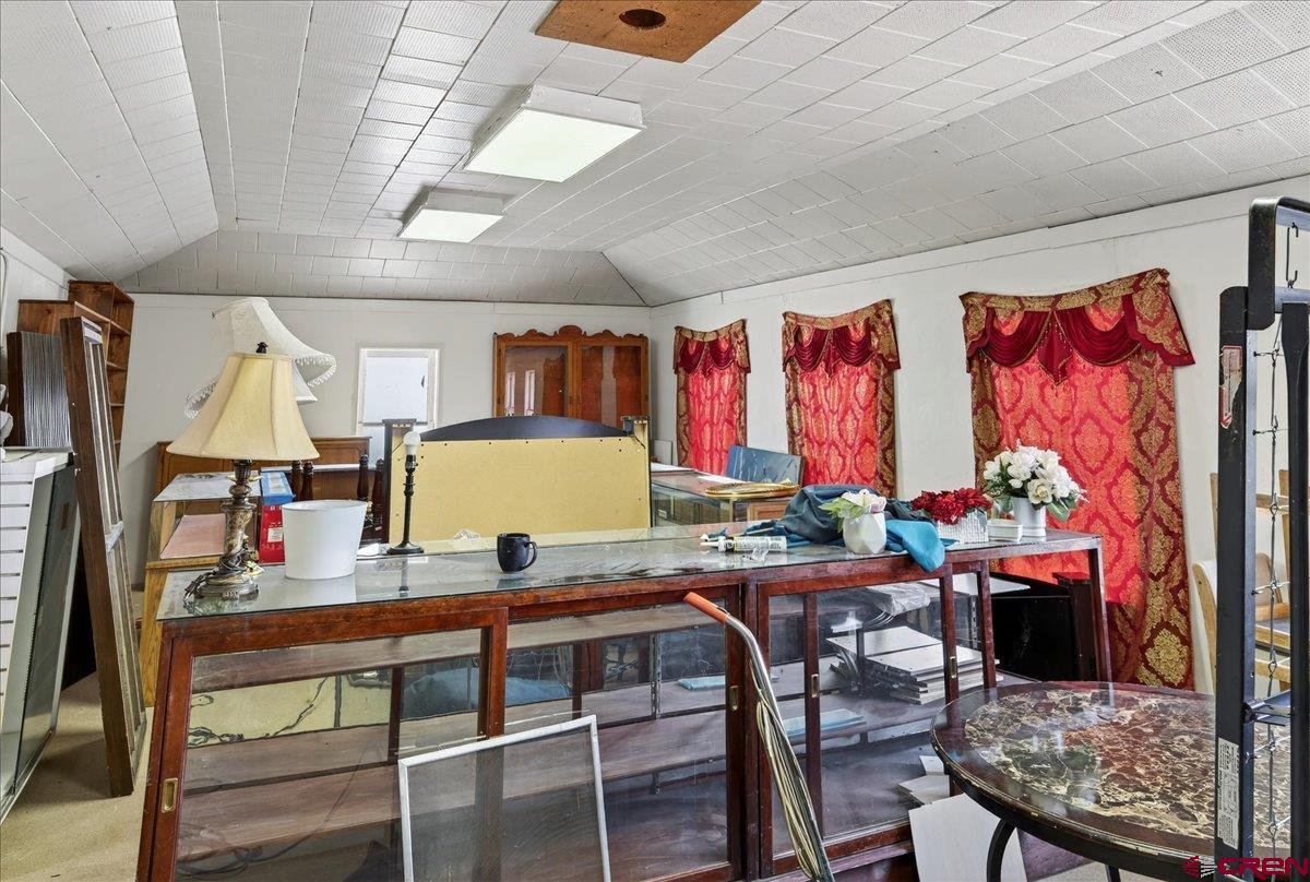 2091 Locust Road Montrose, CO 81401 - Photo 7 of 45 a work room with furniture and a window