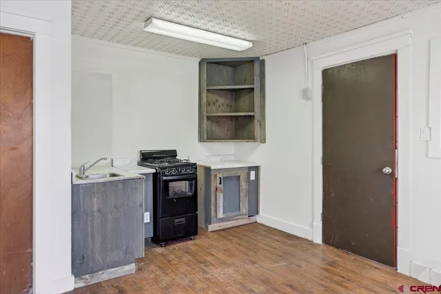 a kitchen with a stove and a refrigerator