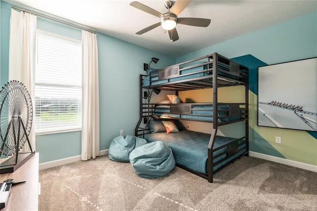 a bedroom with furniture and a window