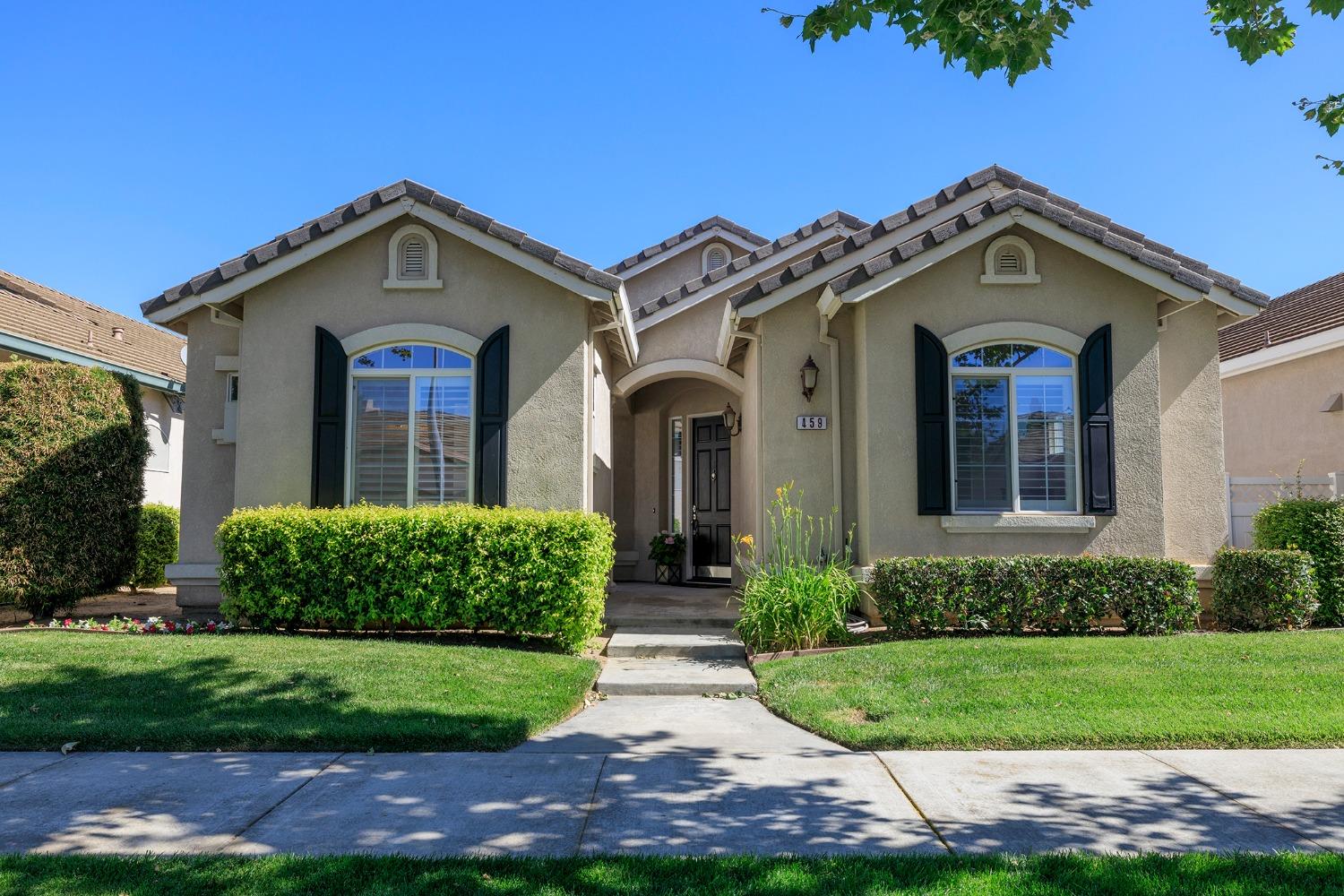 459 Cindy Drive Ripon, CA 95366 - Photo 1 of 1 a front view of a house with a yard