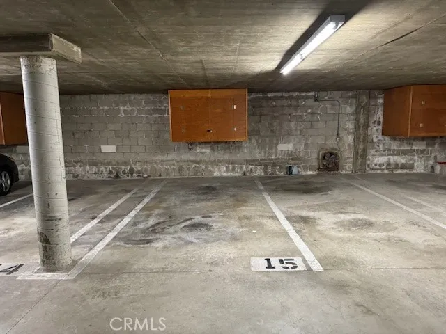 a view of a garden with flowers and trees