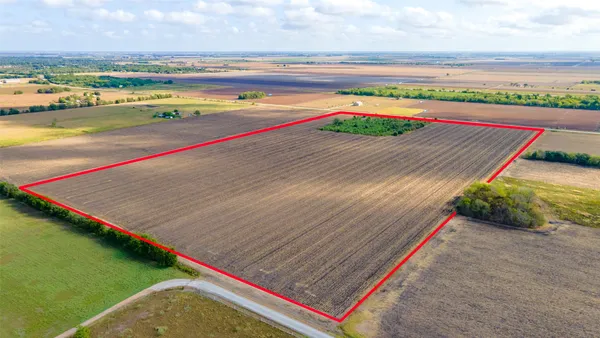 a view of yard with swimming pool and red umbrella
