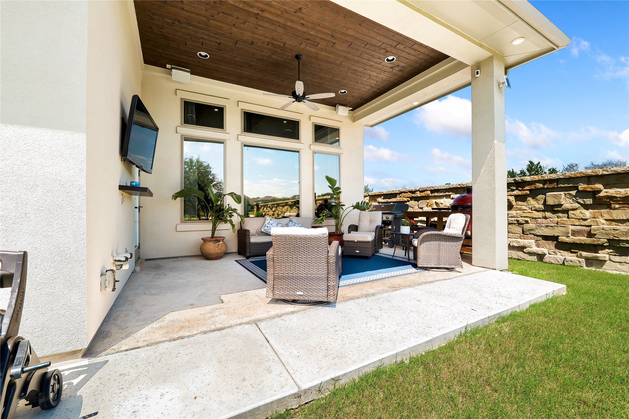 2408 Nate's Place Georgetown, TX 78633 - Photo 32 of 40 An inviting covered patio featuring a rich wood plank ceiling and ample space for outdoor living.
