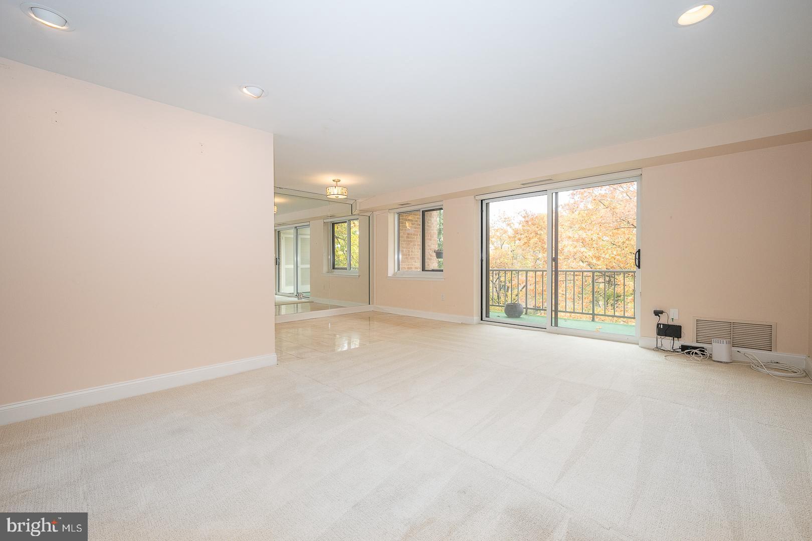 1637 Oakwood Drive, Unit CONDO 218 Penn Valley, PA 19072 - Photo 11 of 39 Living Room Adjacent to Dining Area