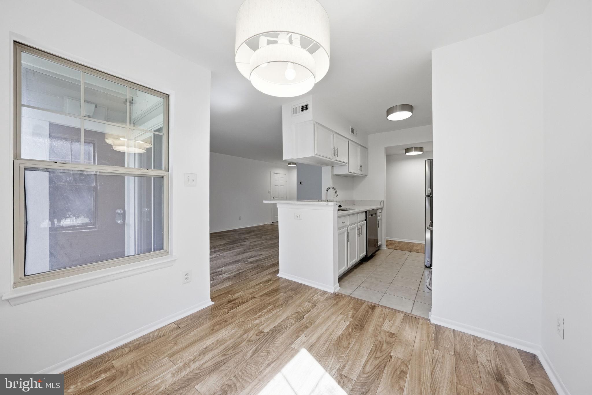 1703 Ascot Way, Unit D Reston, VA 20190 - Photo 7 of 21 a view of a kitchen with electric appliances