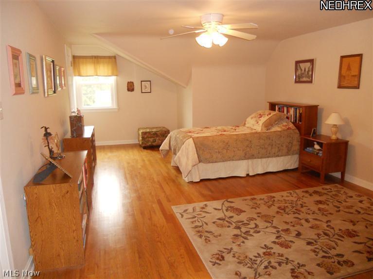 1910 Temblethurst Road South Euclid, OH 44121 - Photo 10 of 13 Bedroom #3 with Gleaming Hardwood Floors, Walk-in Closet & Huge Walk-in Attic