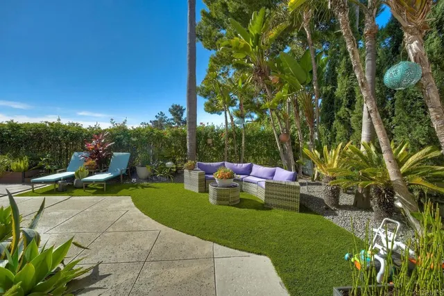 a view of a house with swimming pool and furniture