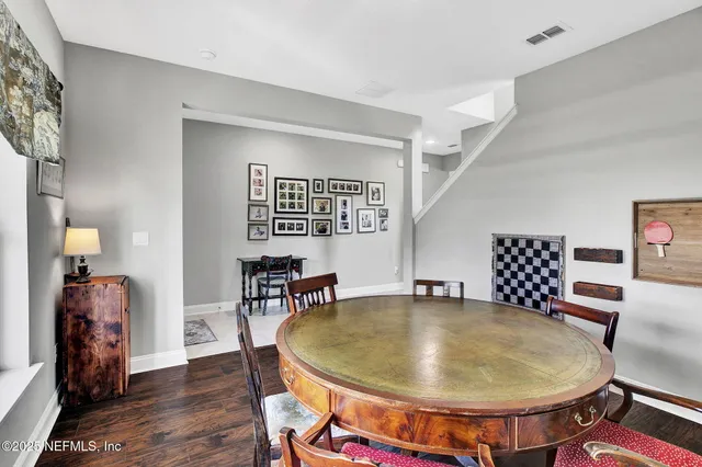 a workspace with furniture and wooden floor