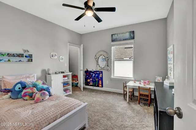 a view of a play room and bedroom