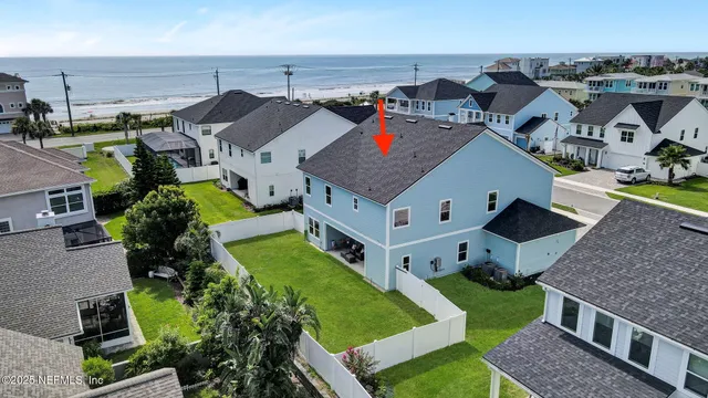 an aerial view of a house with a garden
