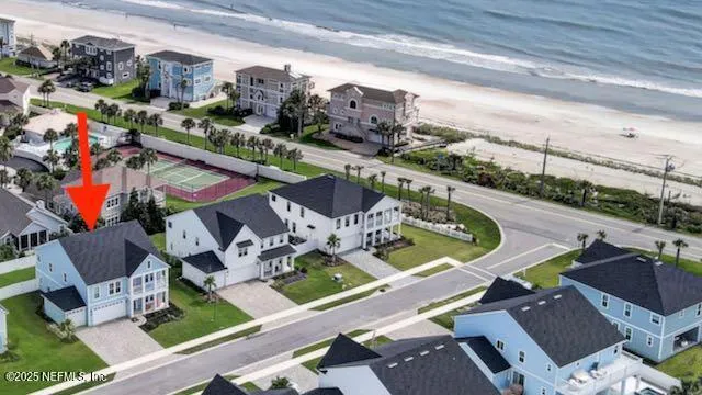 an aerial view of a house with outdoor space