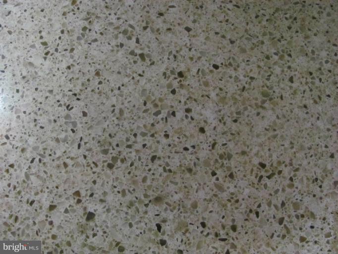 7952 Tick Neck Road Pasadena, MD 21122 - Photo 2 of 27 a close up of a white marble wall