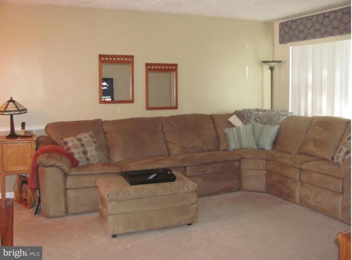 7952 Tick Neck Road Pasadena, MD 21122 - Photo 12 of 27 a living room with furniture and a couch