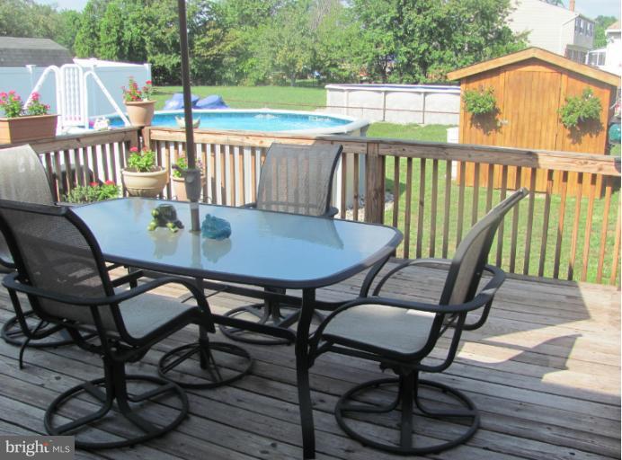 7952 Tick Neck Road Pasadena, MD 21122 - Photo 22 of 27 a view of a chairs and table in the patio