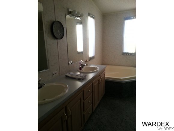 3500 Tooman Road Golden Valley, AZ 86413 - Photo 6 of 7 a bathroom with a sink and a mirror