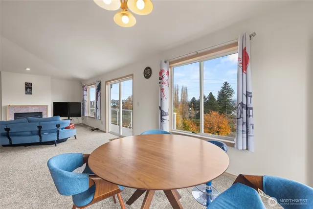 a kitchen with granite countertop a sink appliances cabinets and furniture