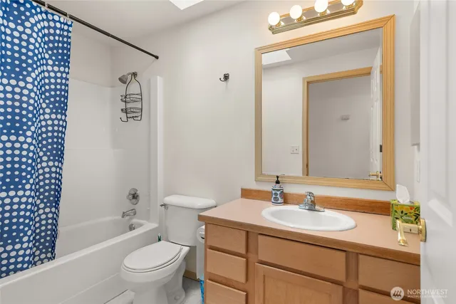 a bed room with a bed and a chair