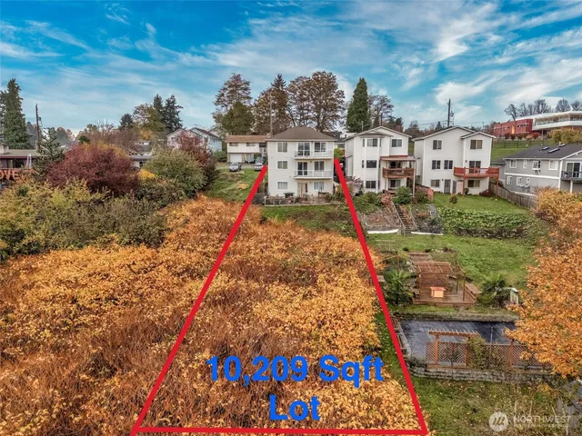 a front view of a house with swimming pool having outdoor seating
