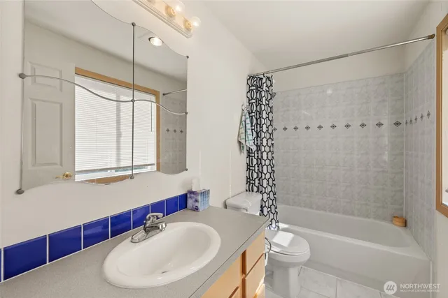 a bathroom with a sink double vanity and a mirror
