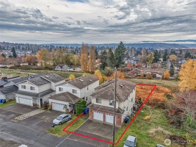 a bathroom with a granite countertop sink toilet a shower and a mirror