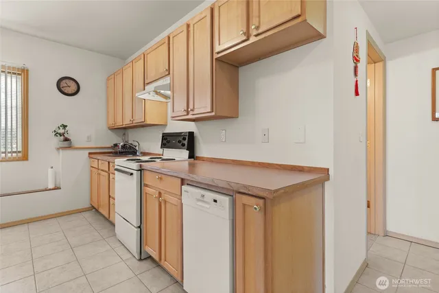 a view of a dining room with furniture and a table