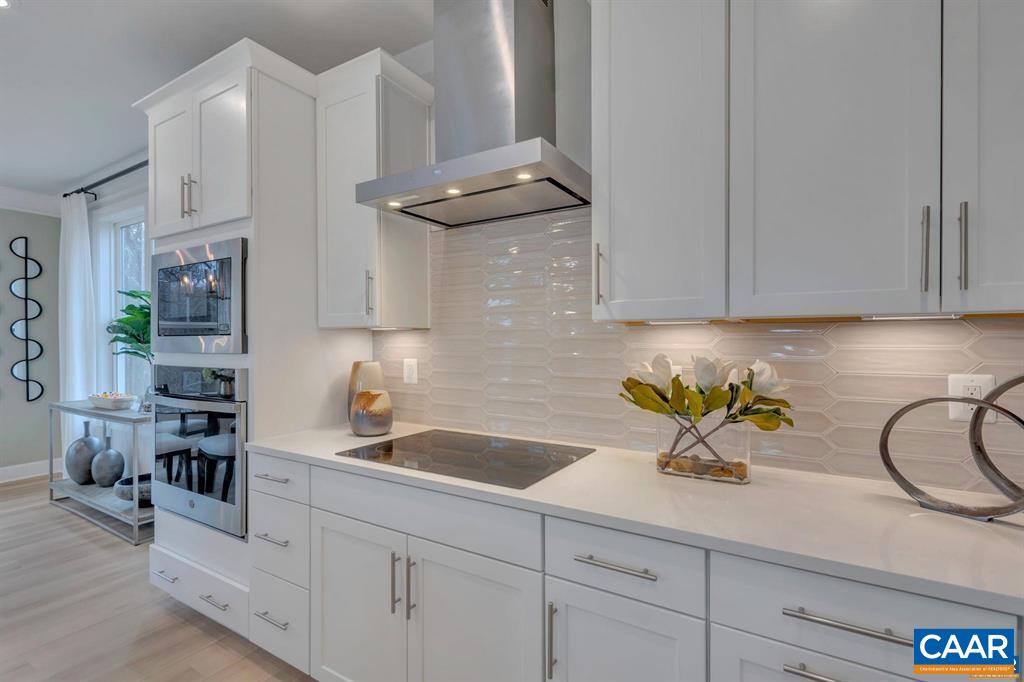2837 Rambling Brook Lane Crozet, VA 22932 - Photo 11 of 24 a kitchen with stainless steel appliances a sink a stove cabinets and a counter top space
