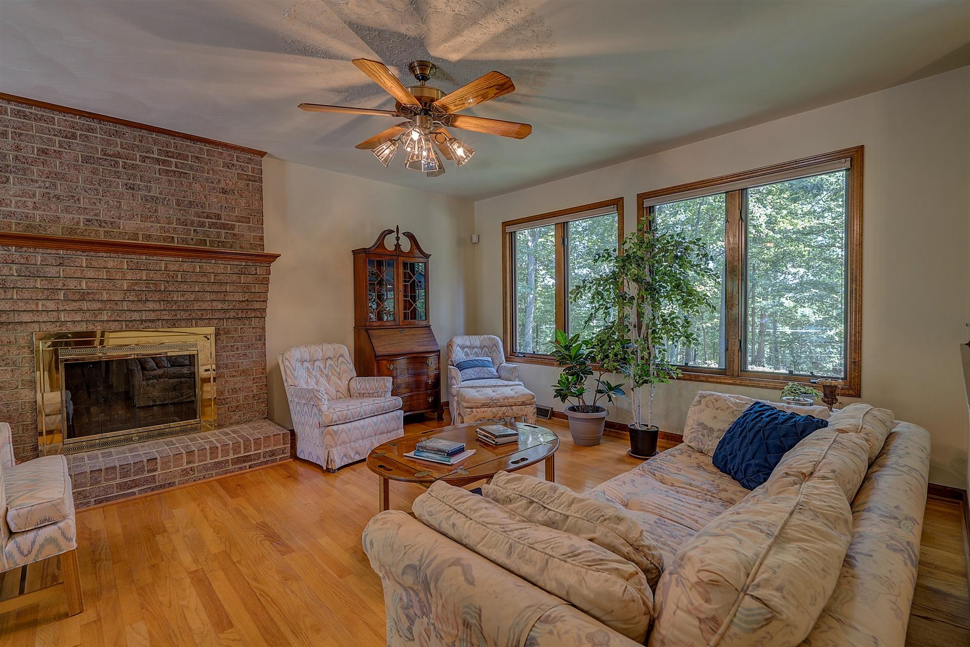 935 Altice Mill Road Rocky Mount, VA 24151 - Photo 11 of 34 a living room with furniture and a fireplace