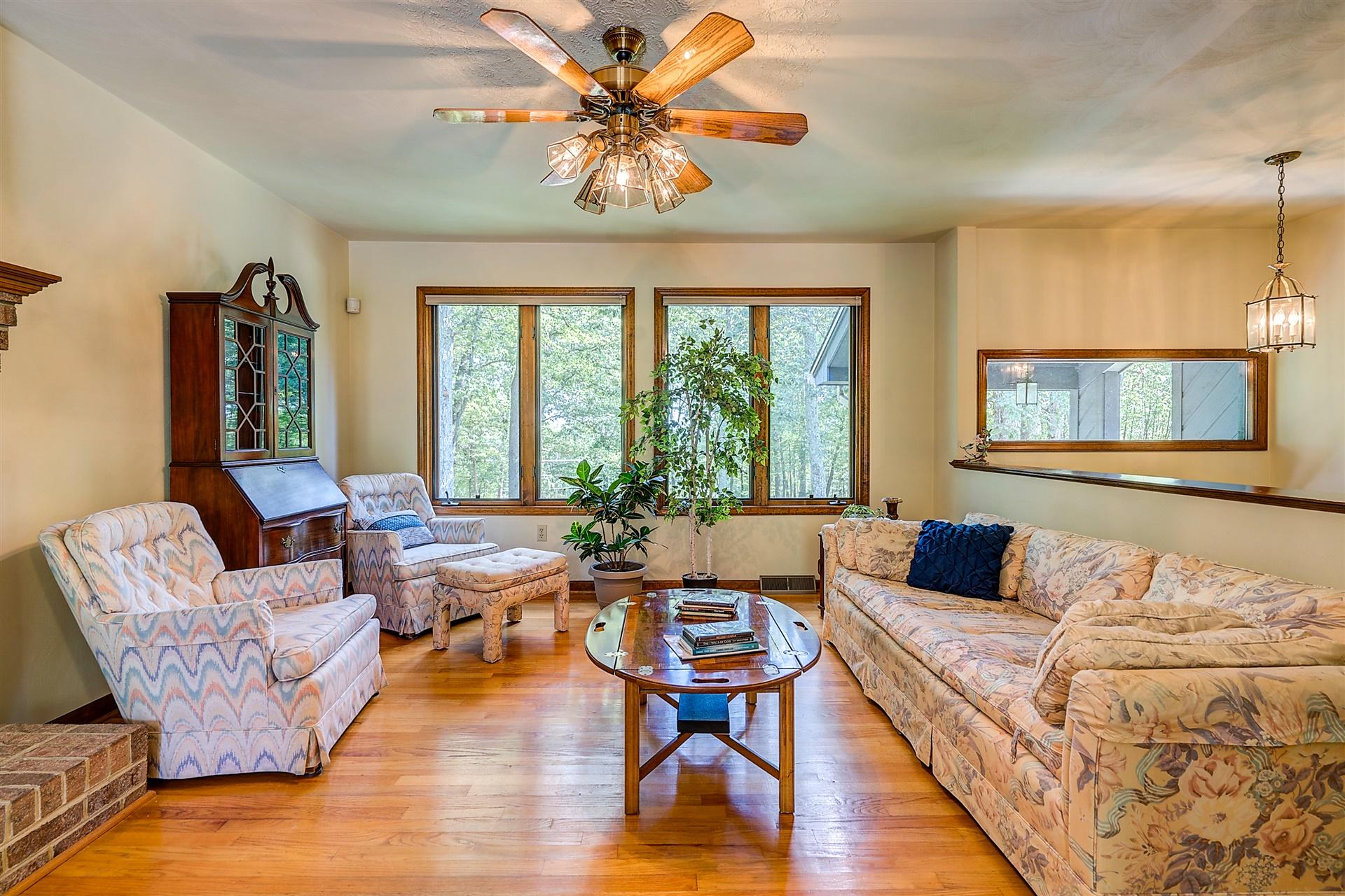 935 Altice Mill Road Rocky Mount, VA 24151 - Photo 12 of 34 a living room with furniture and a large window