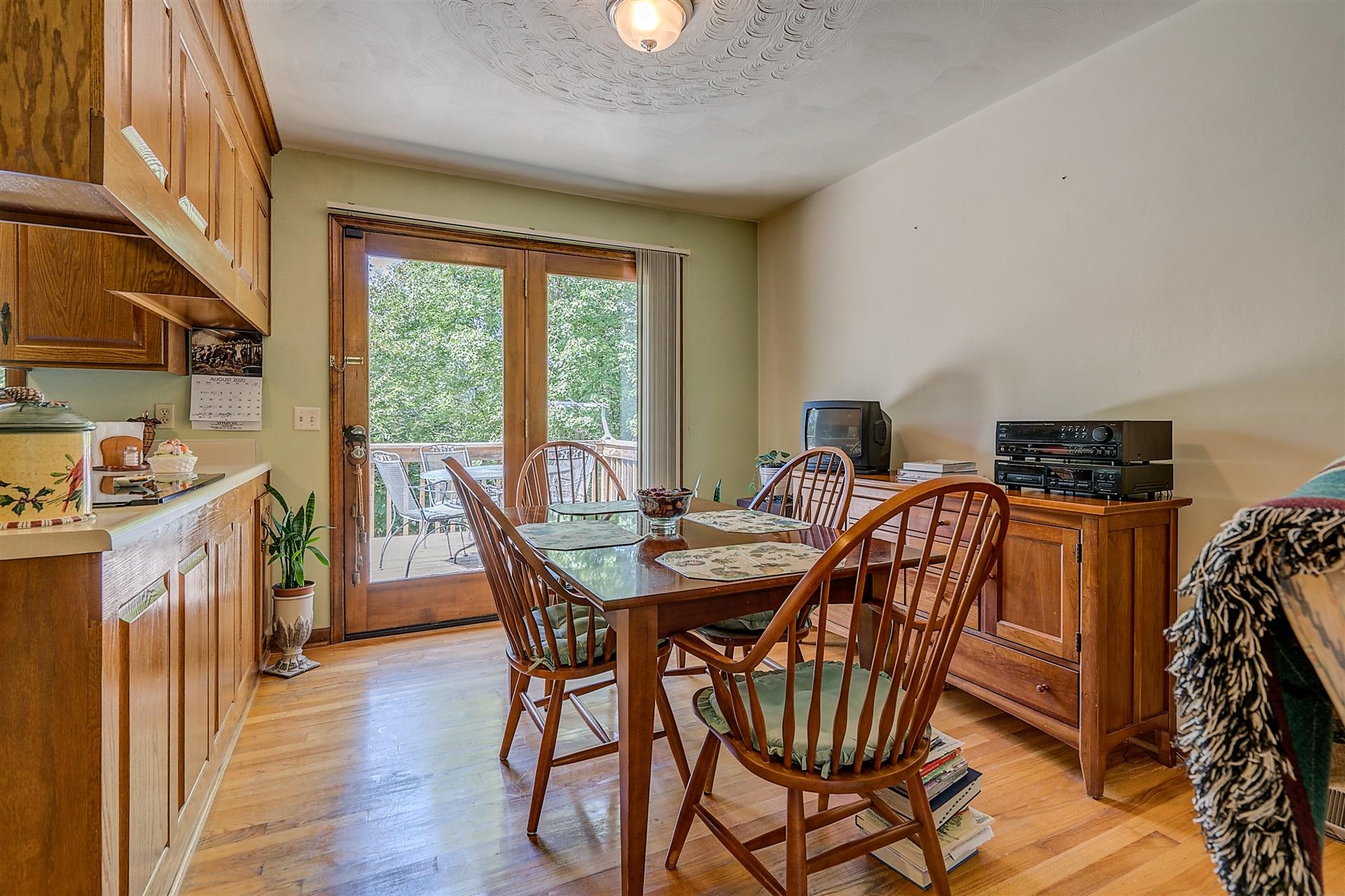 935 Altice Mill Road Rocky Mount, VA 24151 - Photo 14 of 34 a view of a dining room with furniture window and wooden floor
