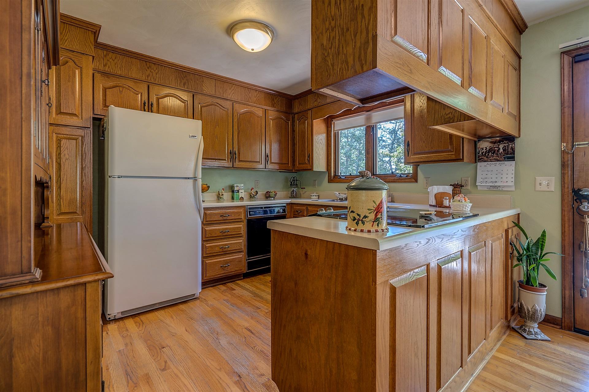 935 Altice Mill Road Rocky Mount, VA 24151 - Photo 16 of 34 a kitchen with stainless steel appliances granite countertop a refrigerator a sink a stove and a refrigerator