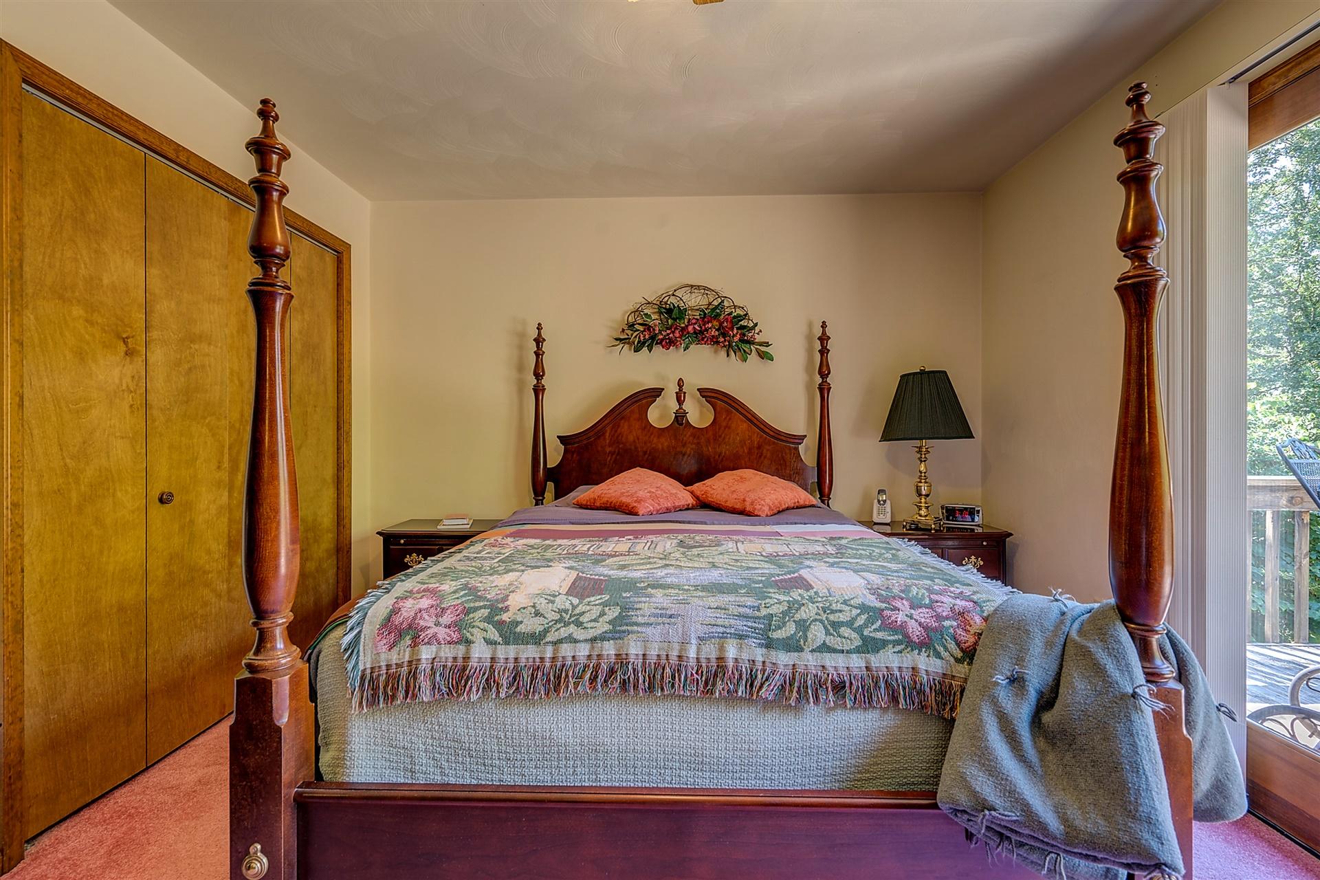 935 Altice Mill Road Rocky Mount, VA 24151 - Photo 24 of 34 a bedroom with a bed and a painting on the wall