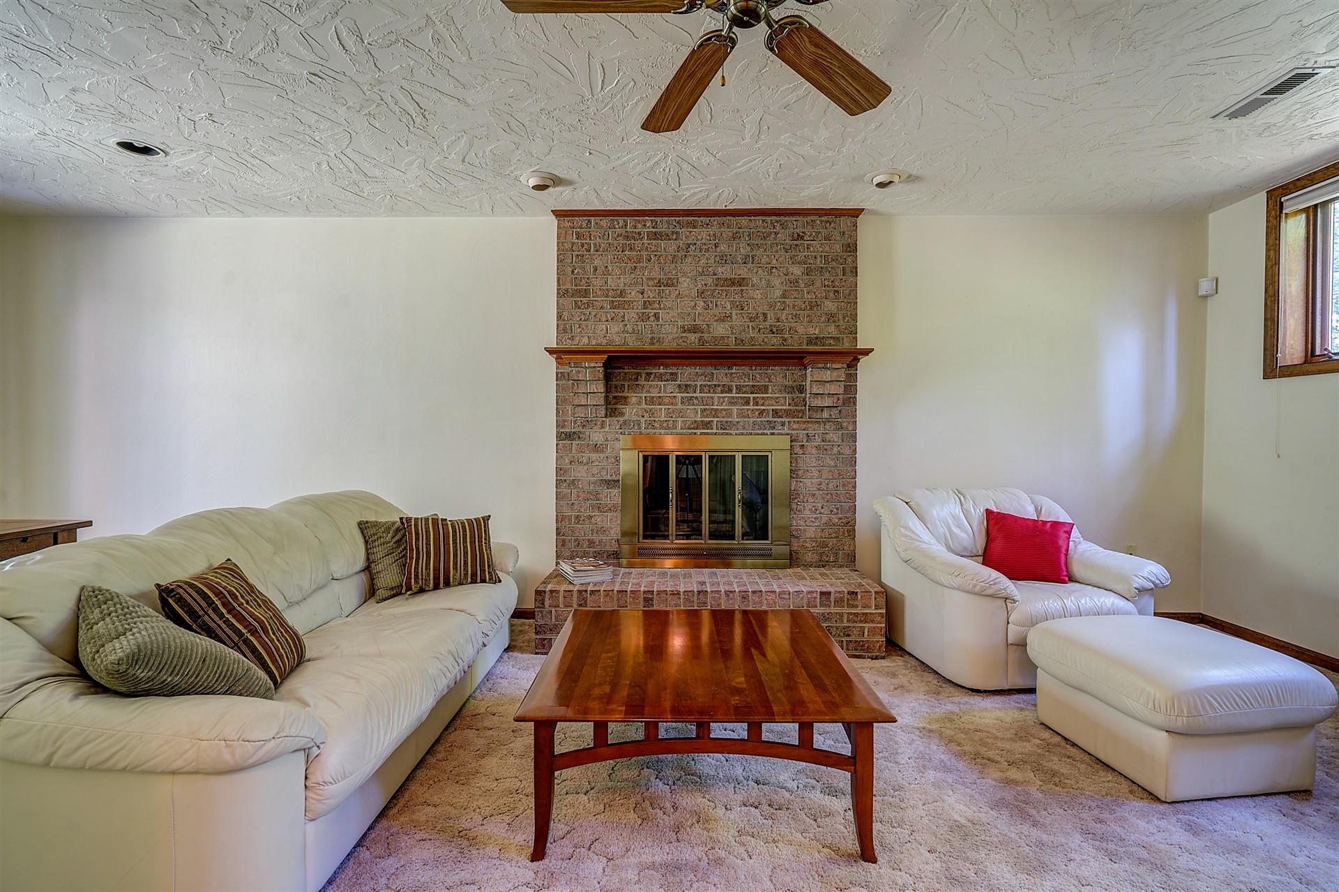 935 Altice Mill Road Rocky Mount, VA 24151 - Photo 28 of 34 a living room with furniture and a fireplace
