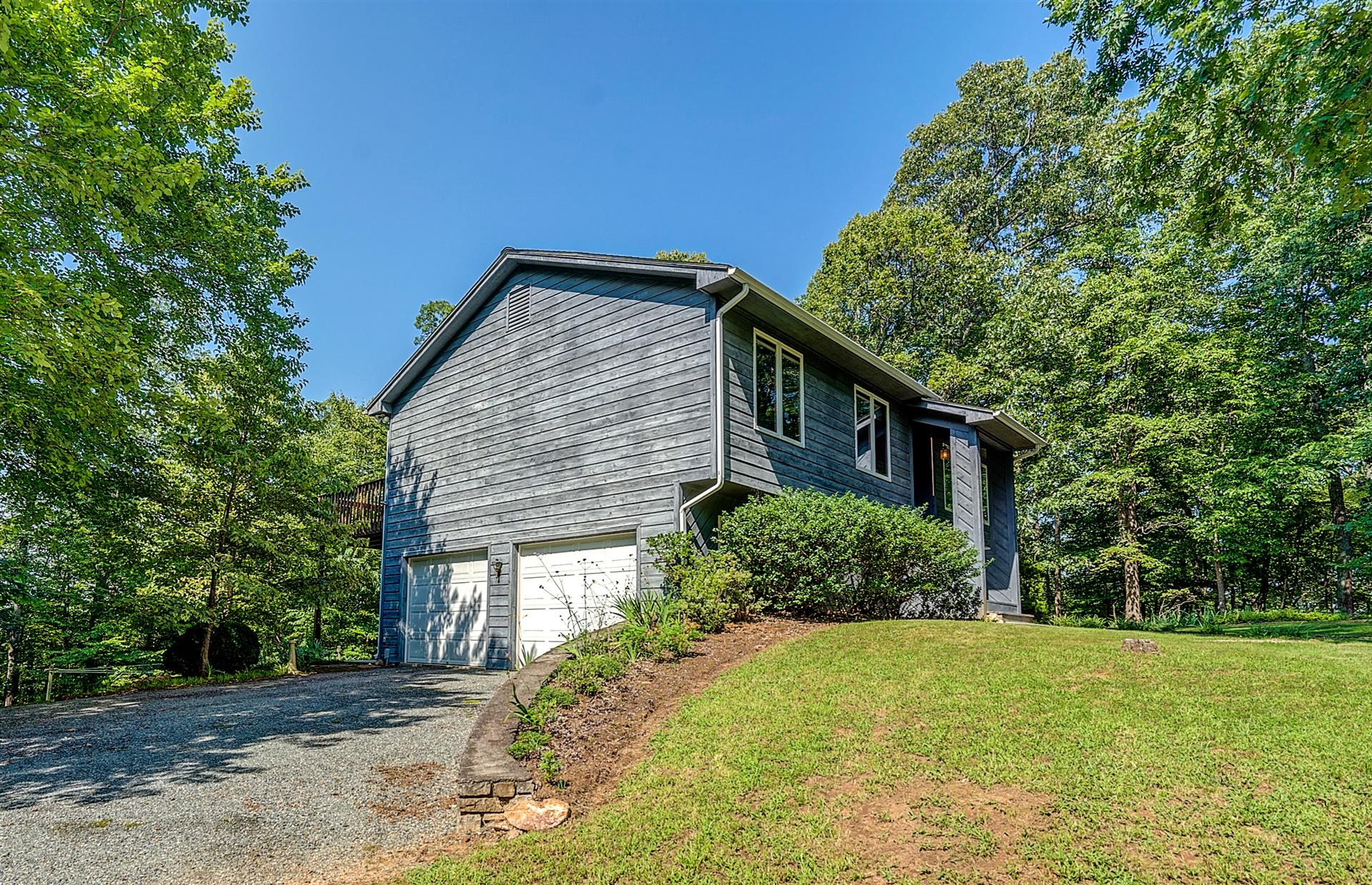 935 Altice Mill Road Rocky Mount, VA 24151 - Photo 5 of 34 a front view of a house with a yard