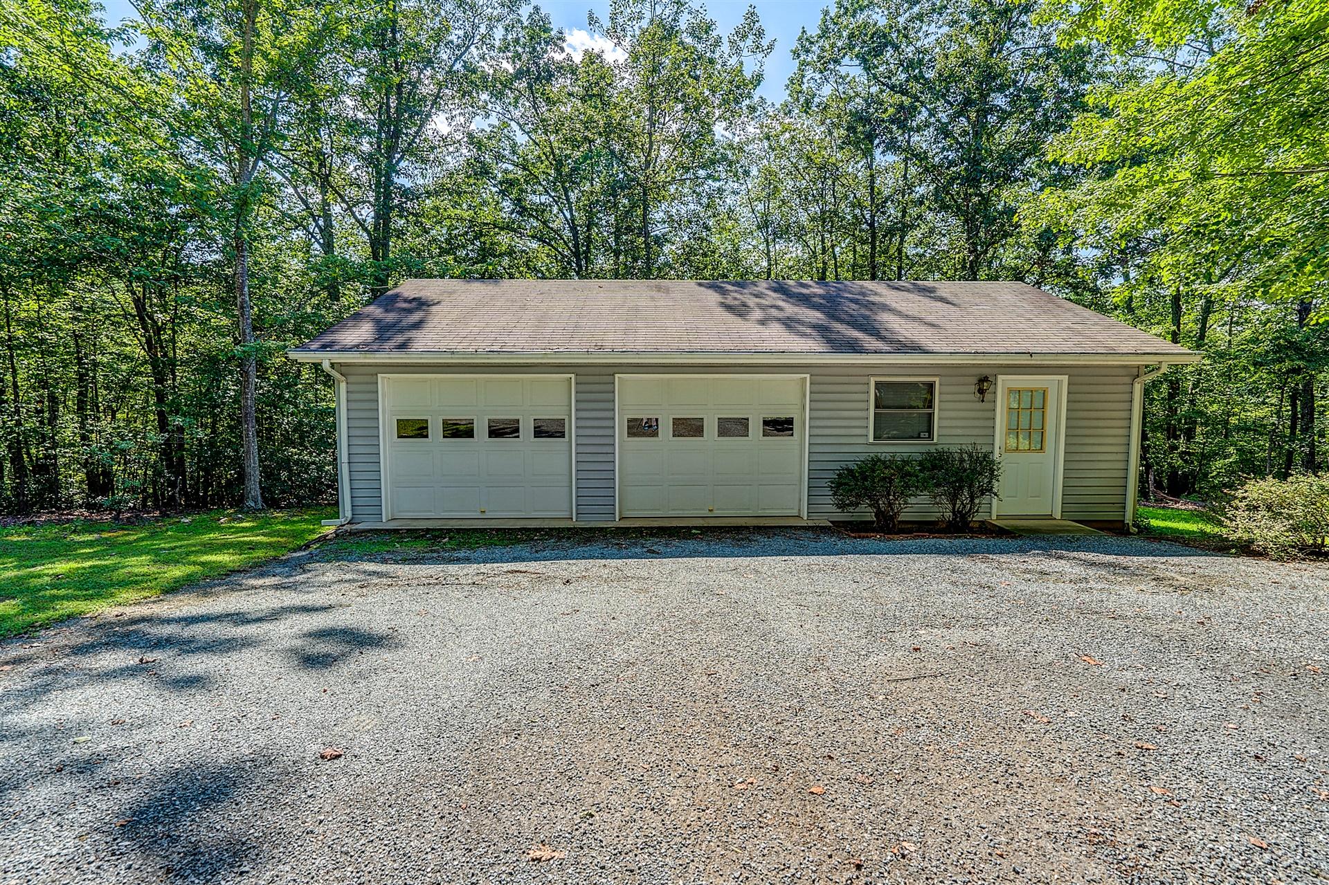 935 Altice Mill Road Rocky Mount, VA 24151 - Photo 6 of 34 a house with trees in the background