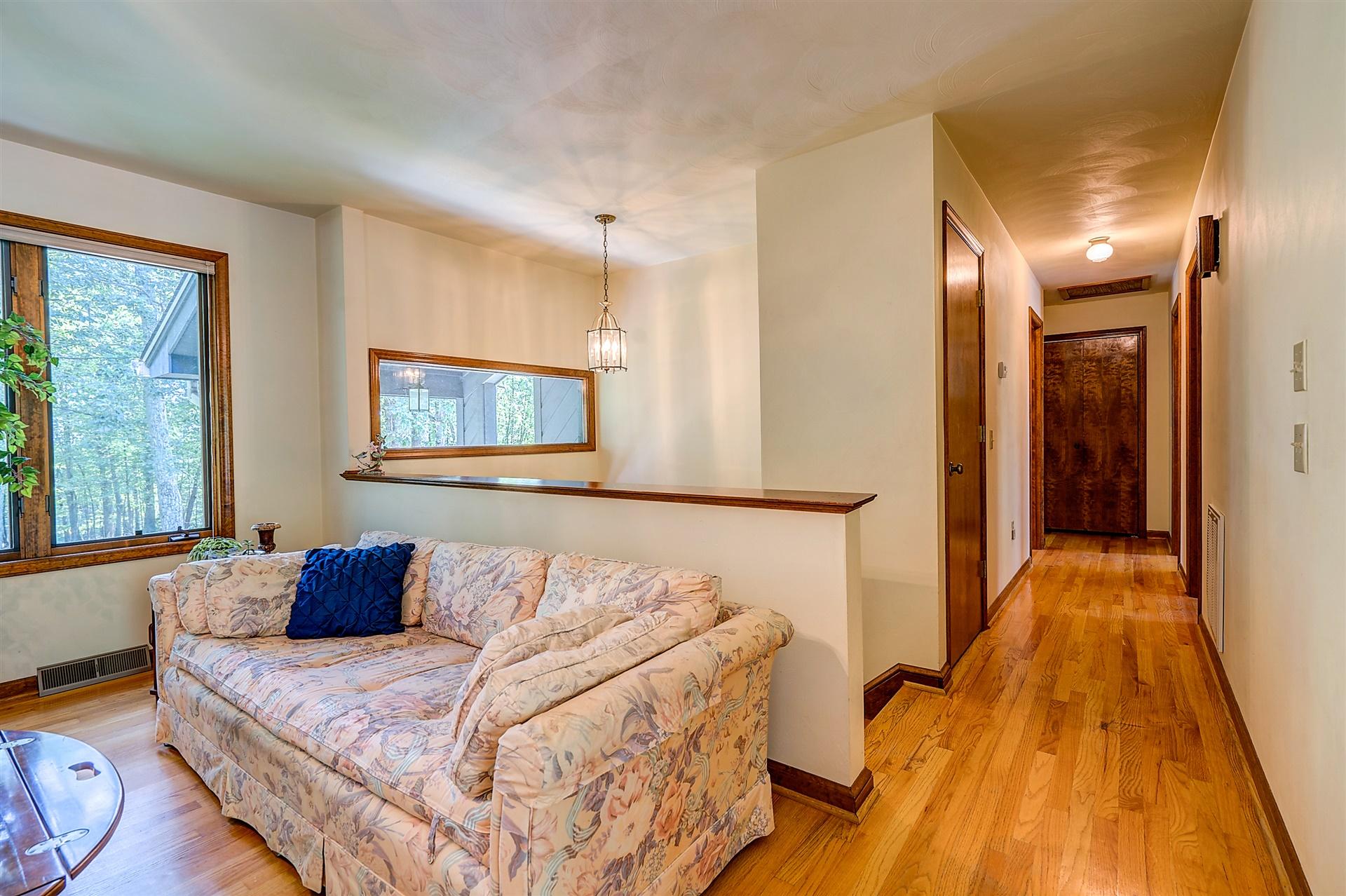 935 Altice Mill Road Rocky Mount, VA 24151 - Photo 10 of 34 a bedroom with a bed and wooden floor