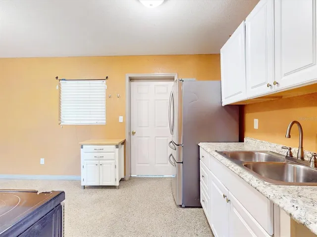 a kitchen with cabinets and a sink