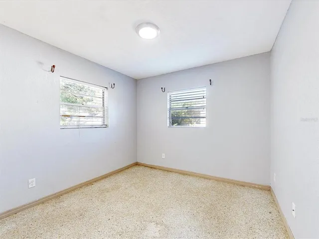 an empty room with windows