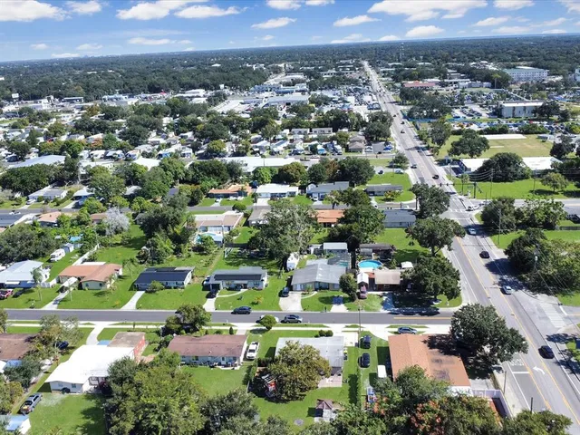 an aerial view of a houses and city street
