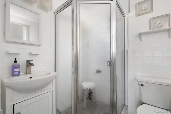 a bathroom with a sink toilet and vanity