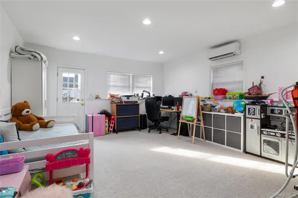 a living room with lots of furniture and toys