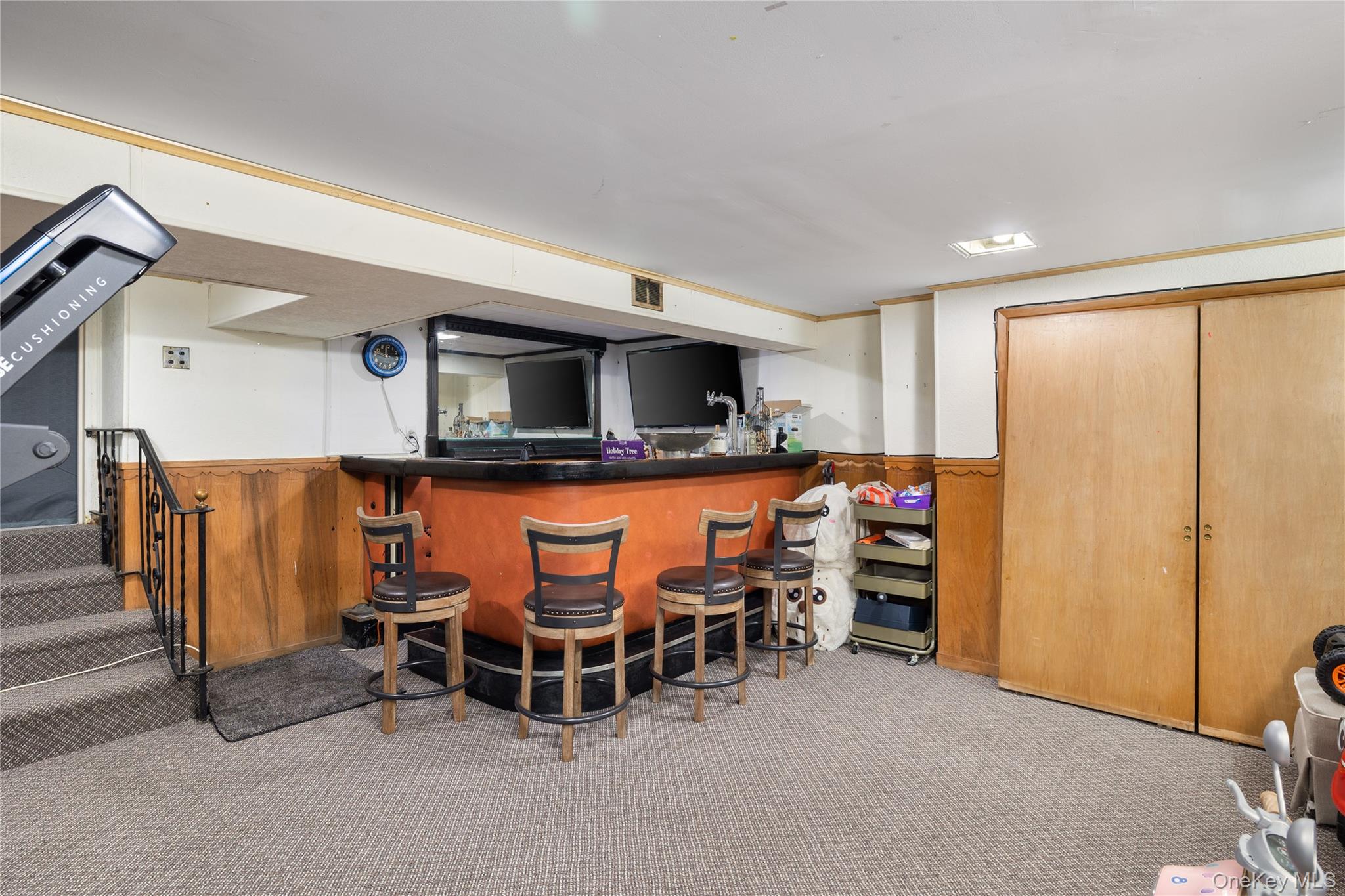 13-52 145th Place Queens, NY 11357 - Photo 20 of 25 a dining room with furniture and a flat screen tv