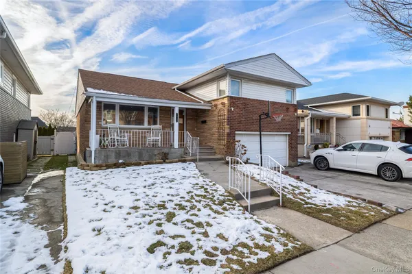 a front view of a house with parking space