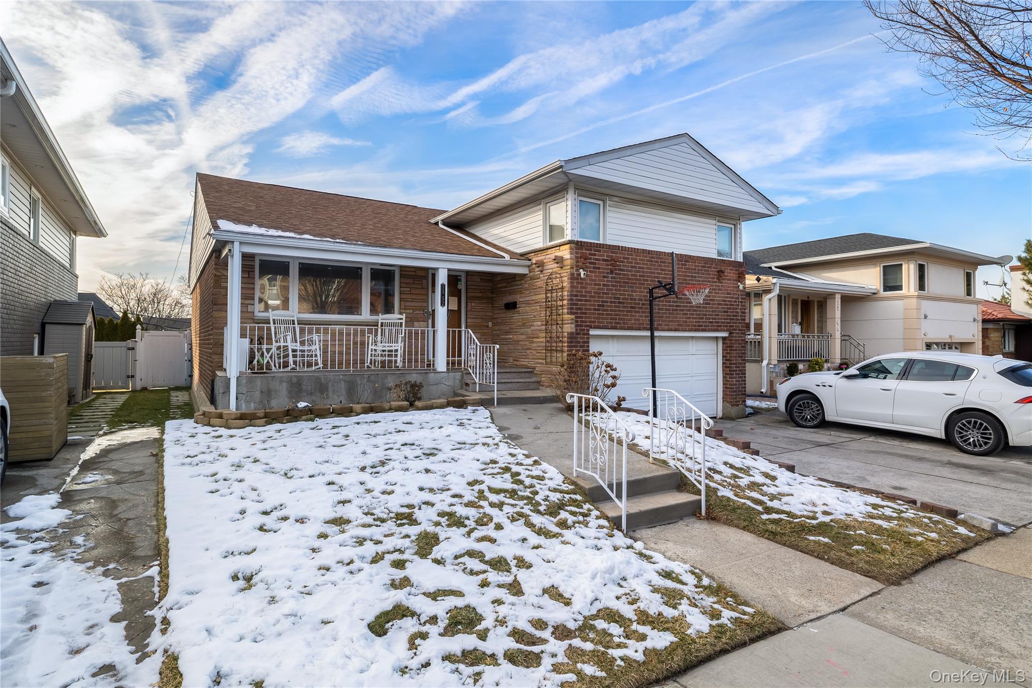 13-52 145th Place Queens, NY 11357 - Photo 2 of 25 a front view of a house with parking space