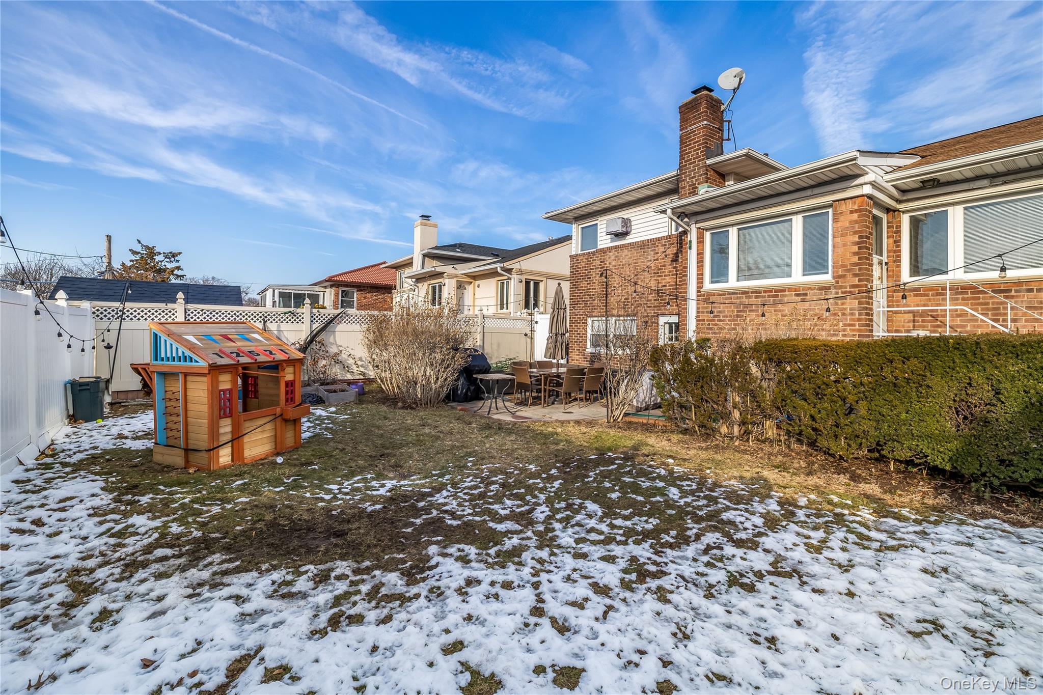 13-52 145th Place Queens, NY 11357 - Photo 24 of 25 a front view of a house with a yard