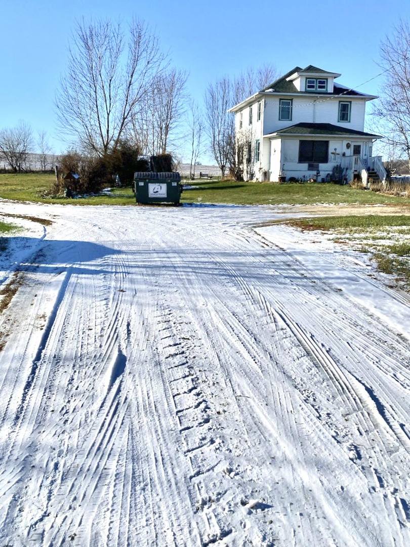 16170 Wheeler Road Durand, IL 61024 - Photo 2 of 12 a view of a house with a yard and sitting area