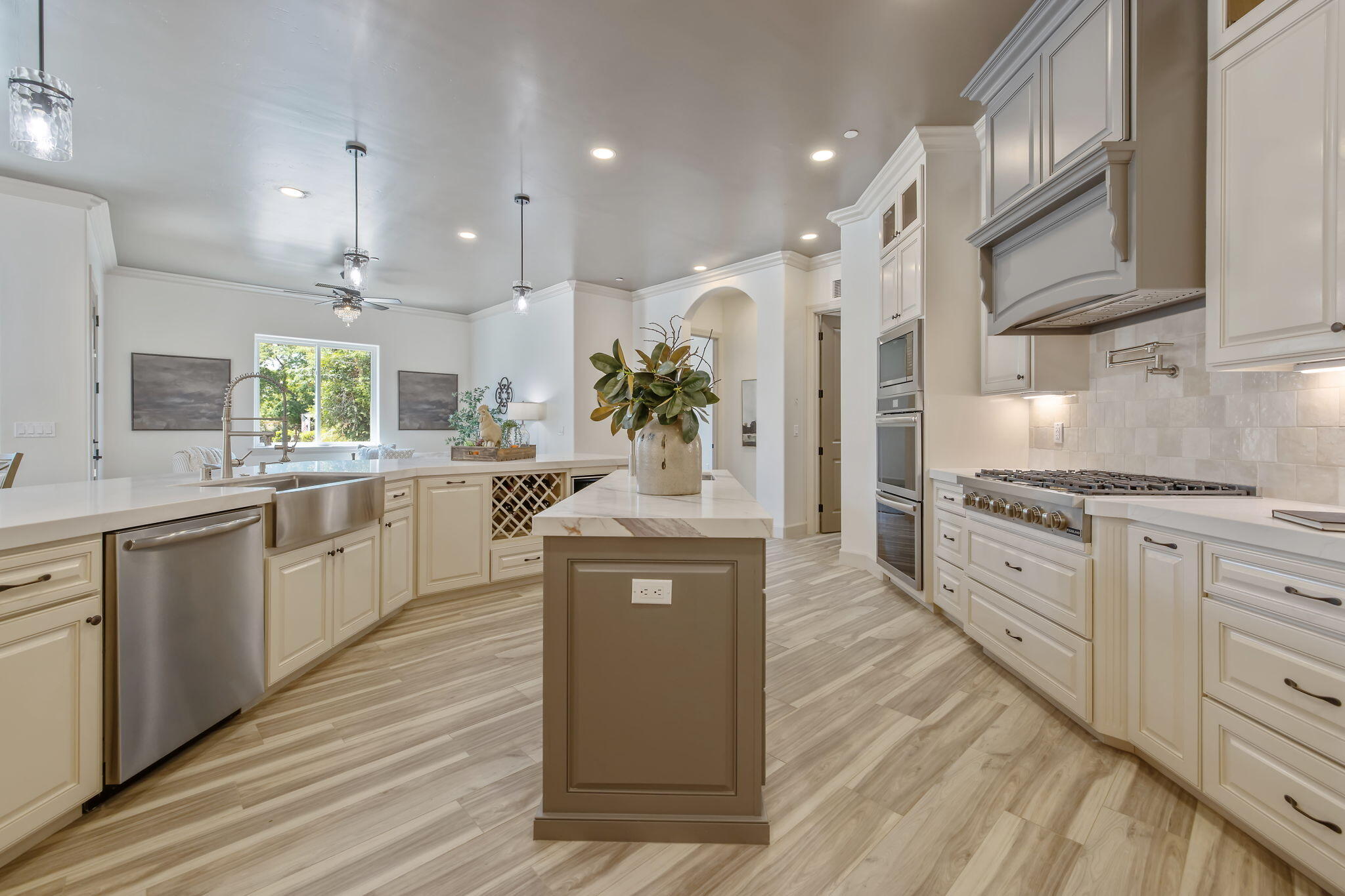 503 East Palm Street Exeter, CA 93221 - Photo 39 of 92 a large kitchen with stainless steel appliances kitchen island granite countertop a lot of counter space and wooden floors