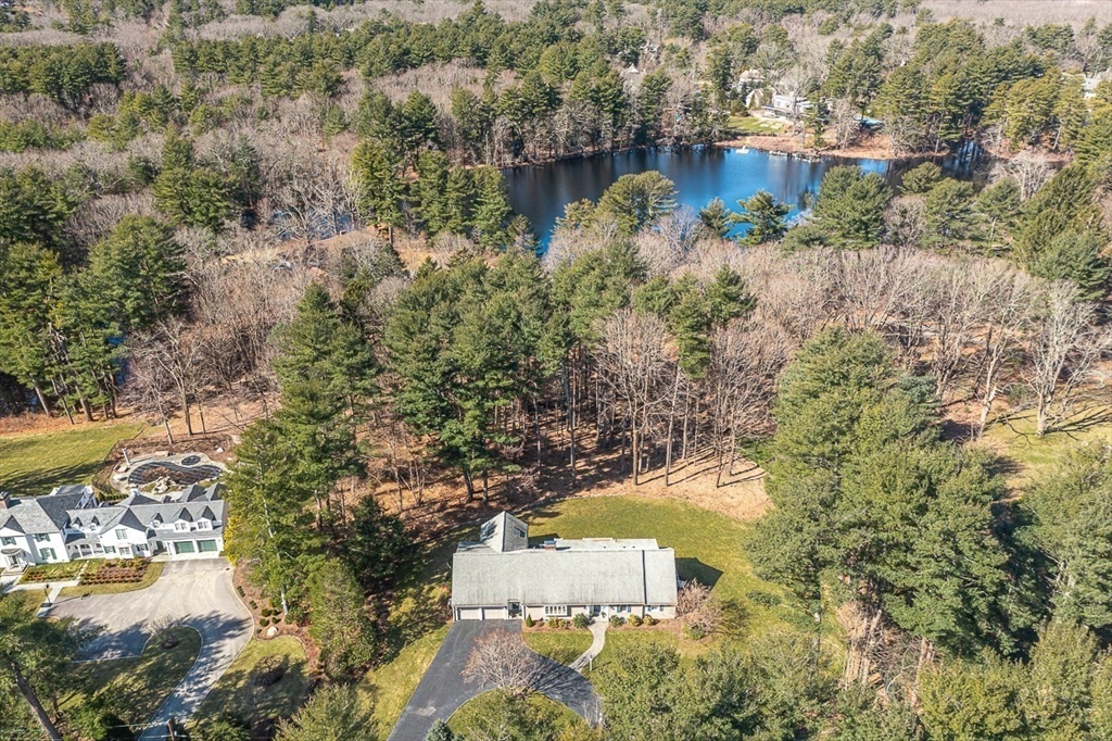 an aerial view of residential house with outdoor space and swimming pool