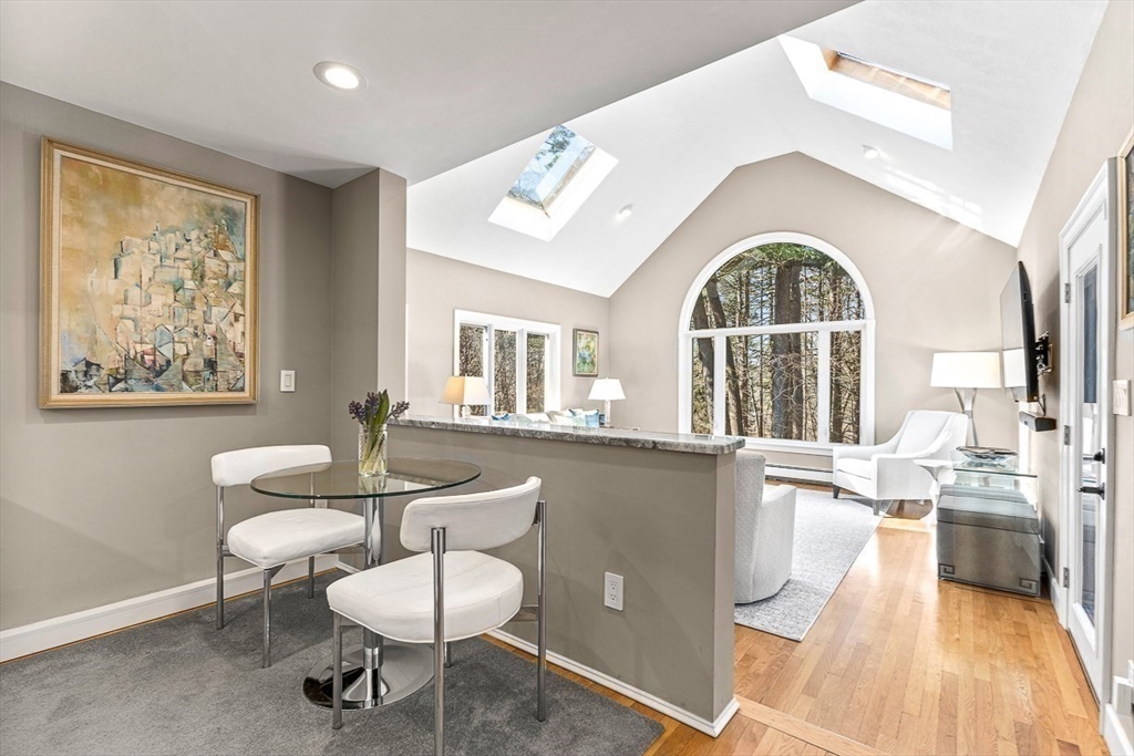 359 Grove Street Needham, MA 02492 - Photo 11 of 37 a living room with furniture and a large window