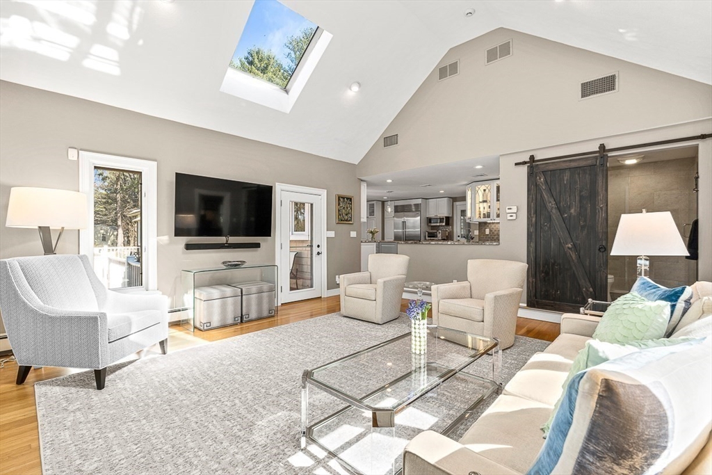 359 Grove Street Needham, MA 02492 - Photo 13 of 37 a living room with furniture and a flat screen tv