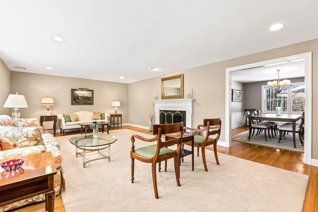 359 Grove Street Needham, MA 02492 - Photo 15 of 37 a living room with fireplace furniture and a wooden floor